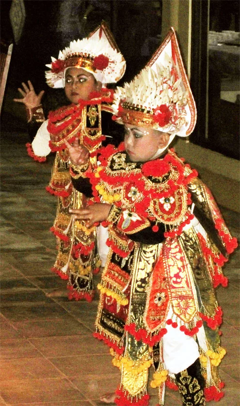 Young Baris dancers performing at Bawang Merah Beachfront Restaurant